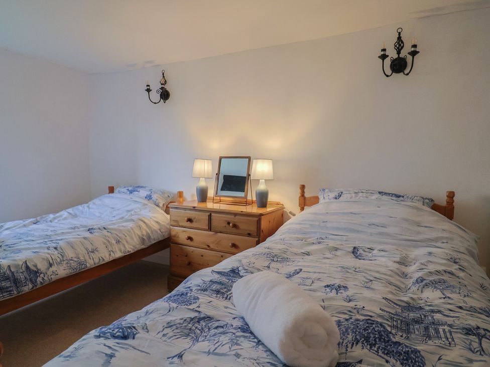 A bedroom with two twin beds and a dresser at Manor Cottage in Kingstone near Ilminster