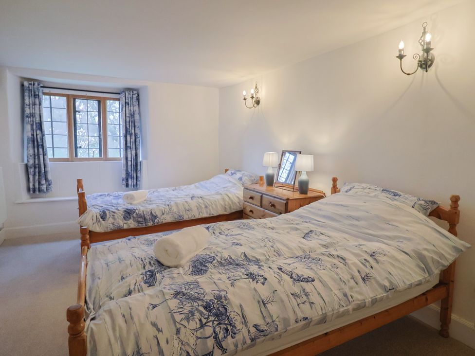 A bedroom with two twin beds and a dresser at Manor Cottage near Ilminster