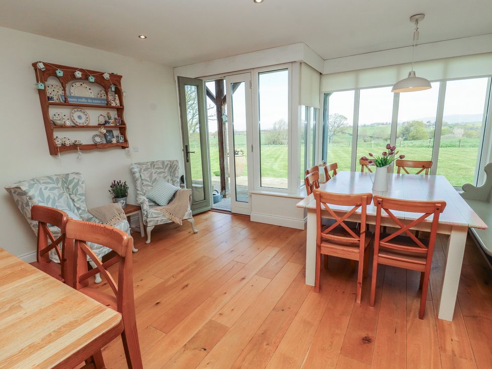 A dining room with a table and chairs at Thimble Hill near Armathwaite