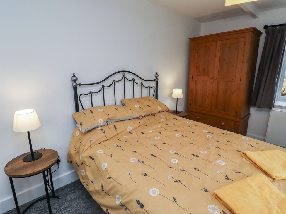 A bedroom with a bed and wardrobe at 1 Sunnybrae Alnwick