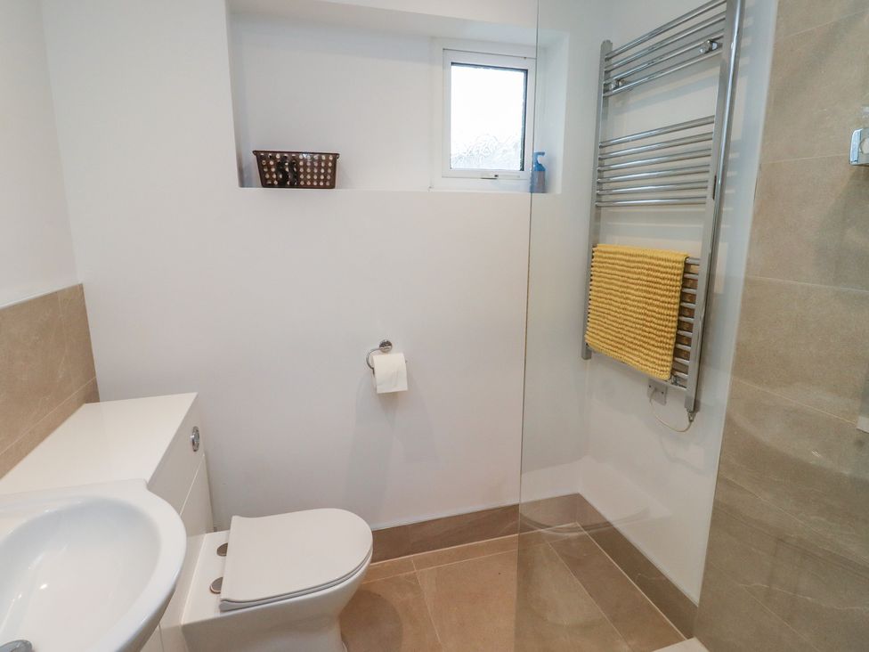 A bathroom with a toilet, sink, and towel rail at 1 Sunnybrae in Alnwick