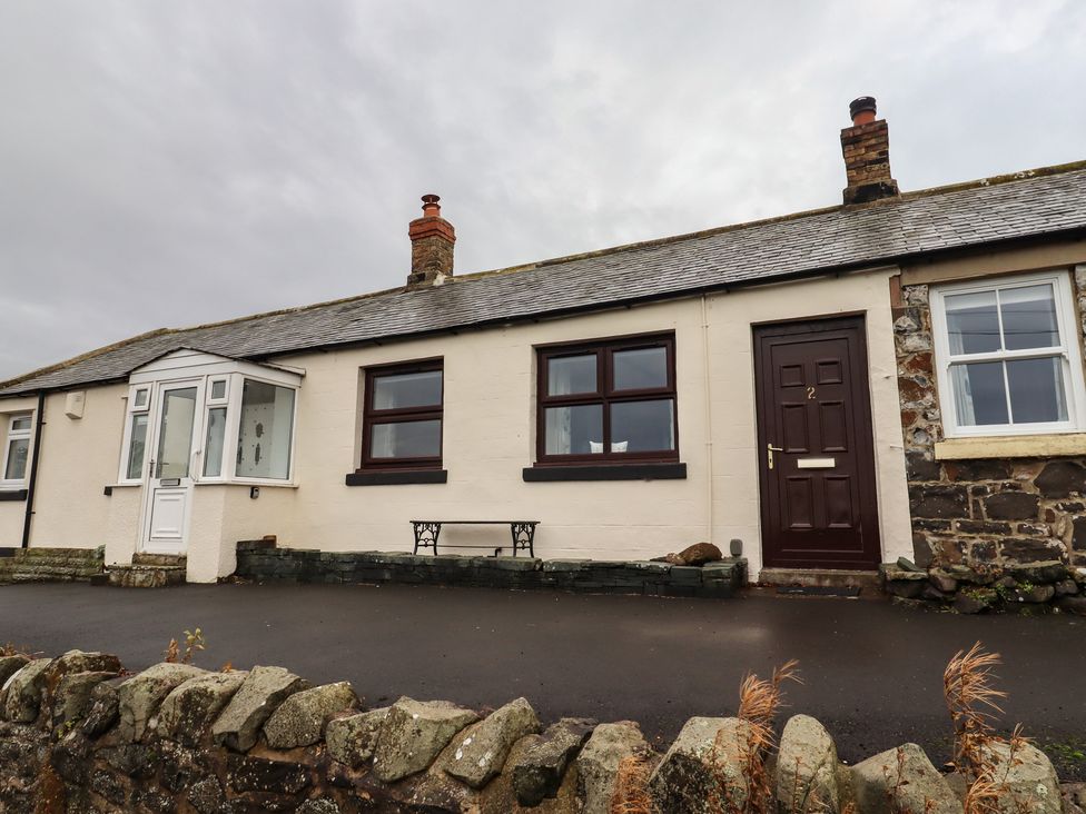 A cottage exterior with a front door and windows at 1 Sunnybrae Alnwick