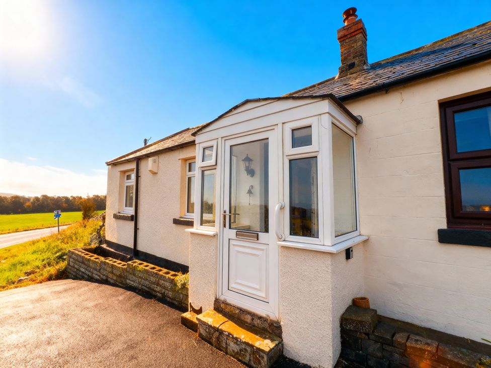 A front porch with a door and windows at 1 Sunny Brae in Embleton