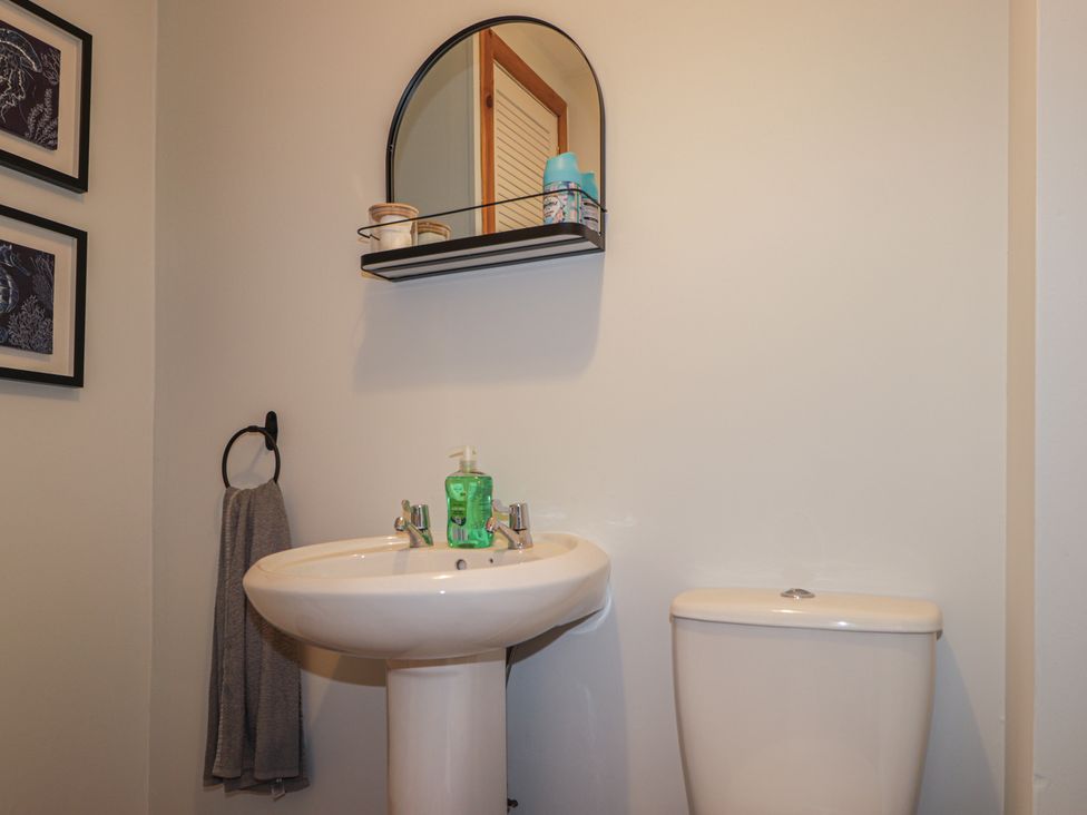 A bathroom with a sink and toilet at Clans Crescent Nairn