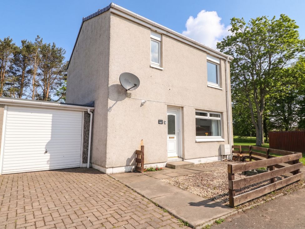 A house with a garage and a satellite dish at Taigh Ban in Nairn