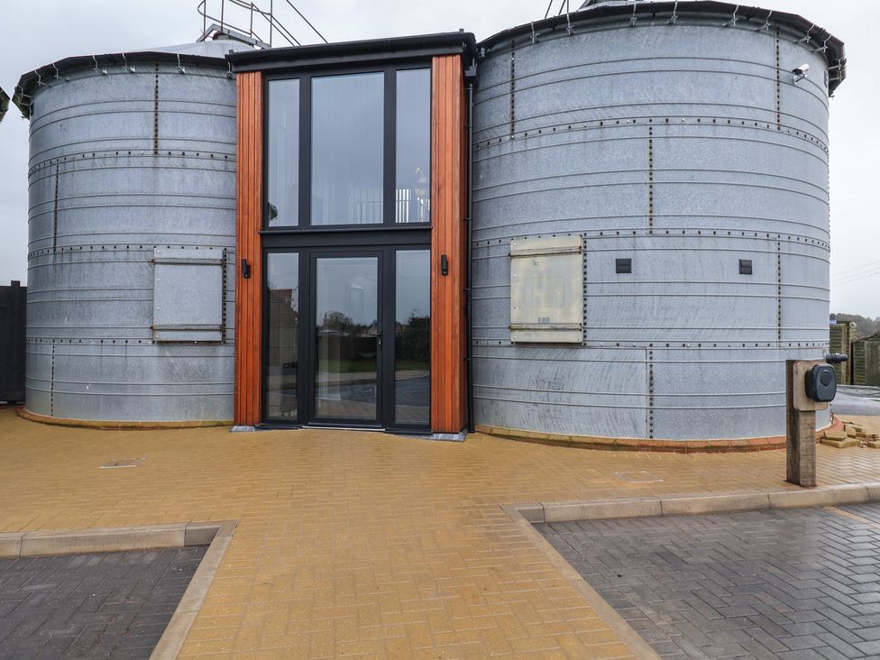 A building with silos and entrance door at Unit 1 in Ipswich