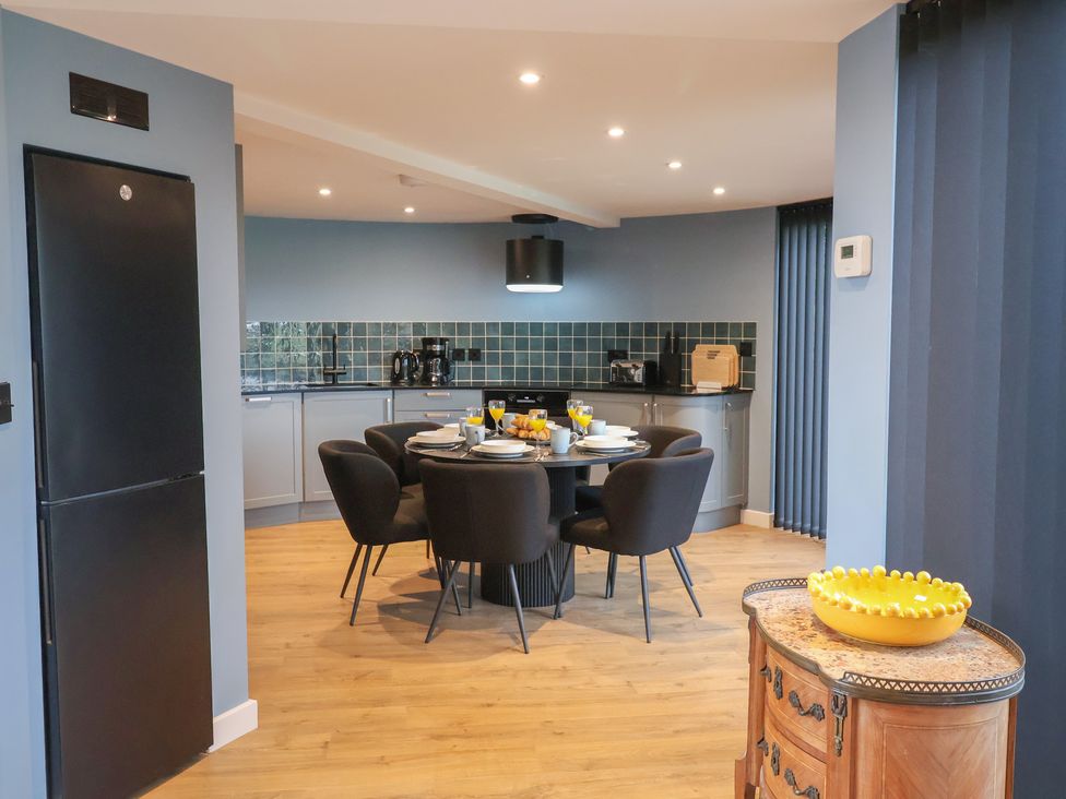 A kitchen with a table and chairs at Unit 2 Ipswich