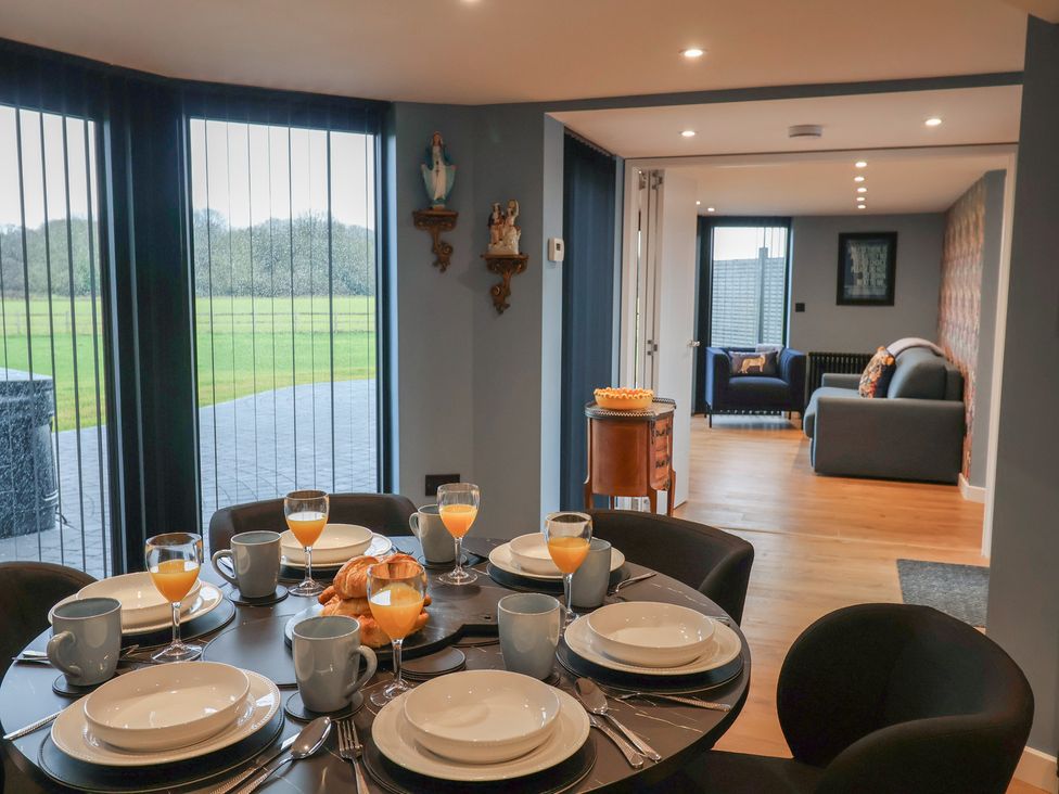 A dining room with table set for breakfast at Unit 2 Ipswich
