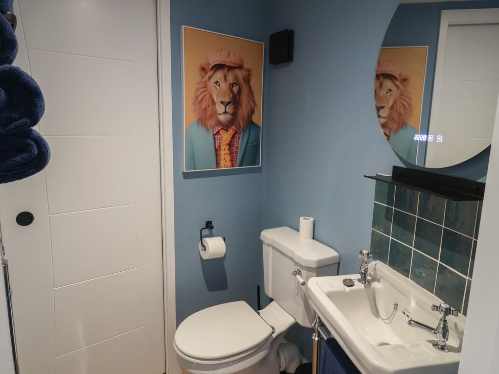 A bathroom with a toilet and sink at Unit 2 in Ipswich