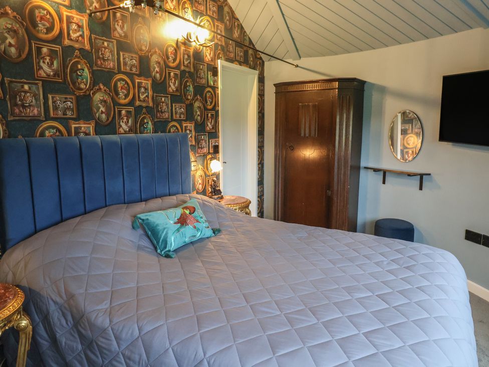 A bedroom with a bed and wardrobe at Unit 2 Ipswich