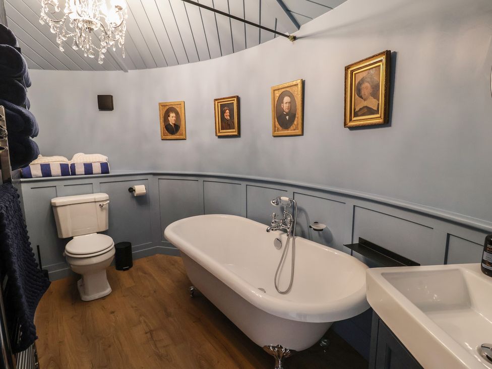 A bathroom with a bathtub and sink at Unit 2 in Ipswich