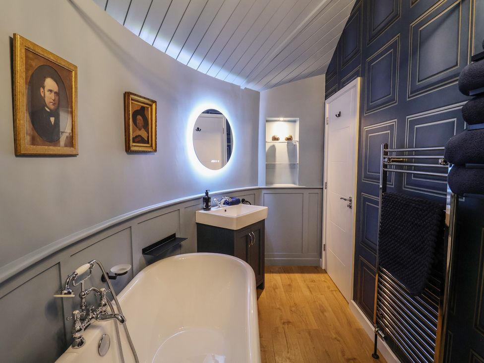 A bathroom with a bathtub and sink at Unit 2 in Ipswich