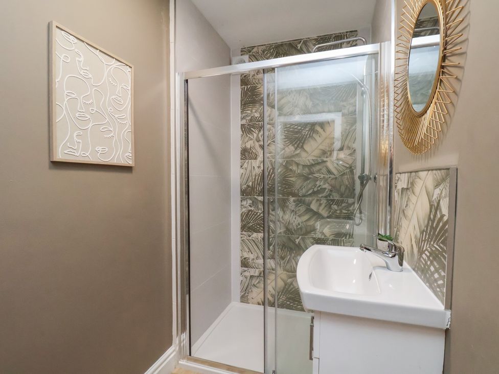 A bathroom featuring a shower and wash basin at Apartment 2, Blackburn Heights in Bridlington
