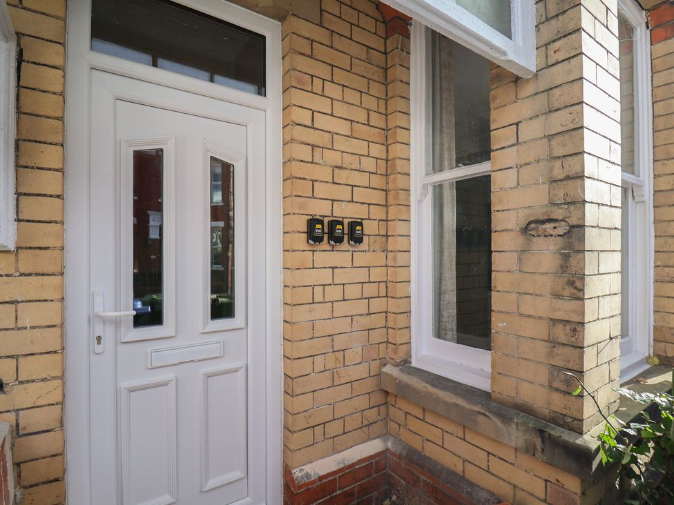 An entryway with a front door and utility meters at Apartment 2, Blackburn Heights in Bridlington