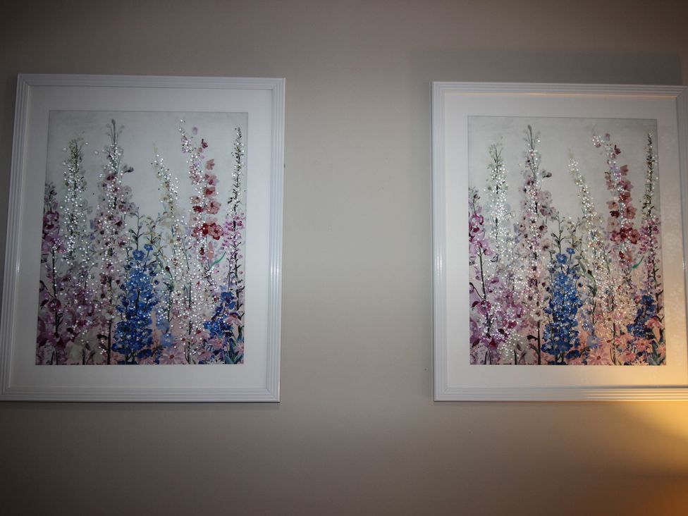 Two framed flower artworks on a wall at Blackburn Heights Apartment in Bridlington