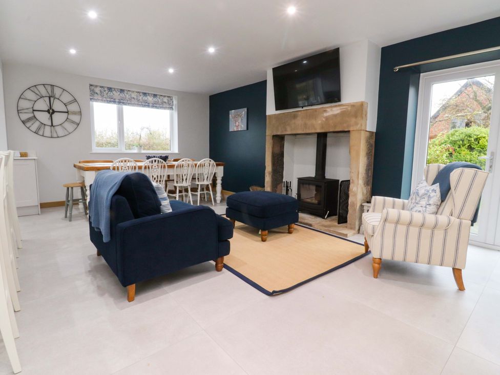 A dining room with a table and chairs at Brook House in Broughton, Lancashire