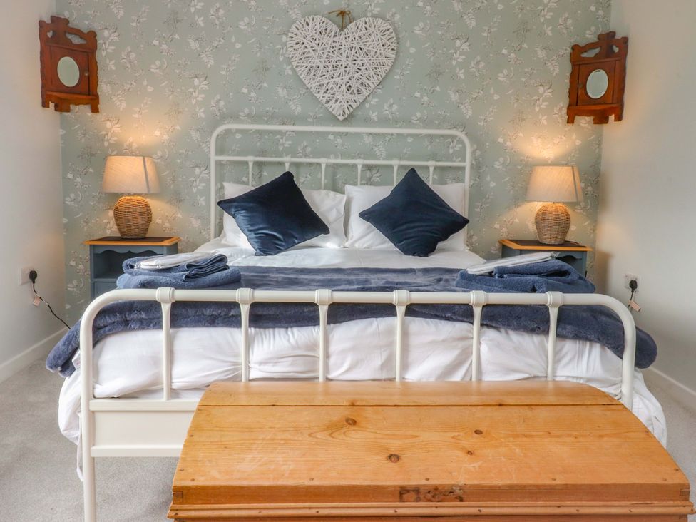 A bedroom with a bed and bedside tables at Brook House in Broughton, Lancashire