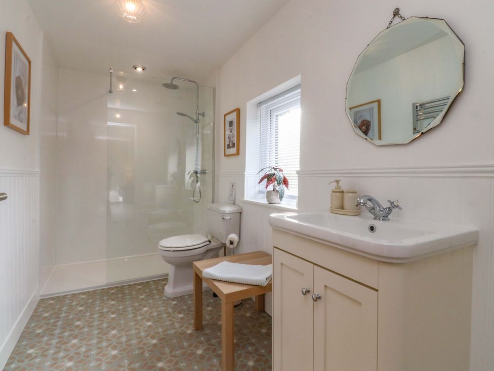 A bathroom with shower, toilet, and sink at Brook House in Broughton, Lancashire