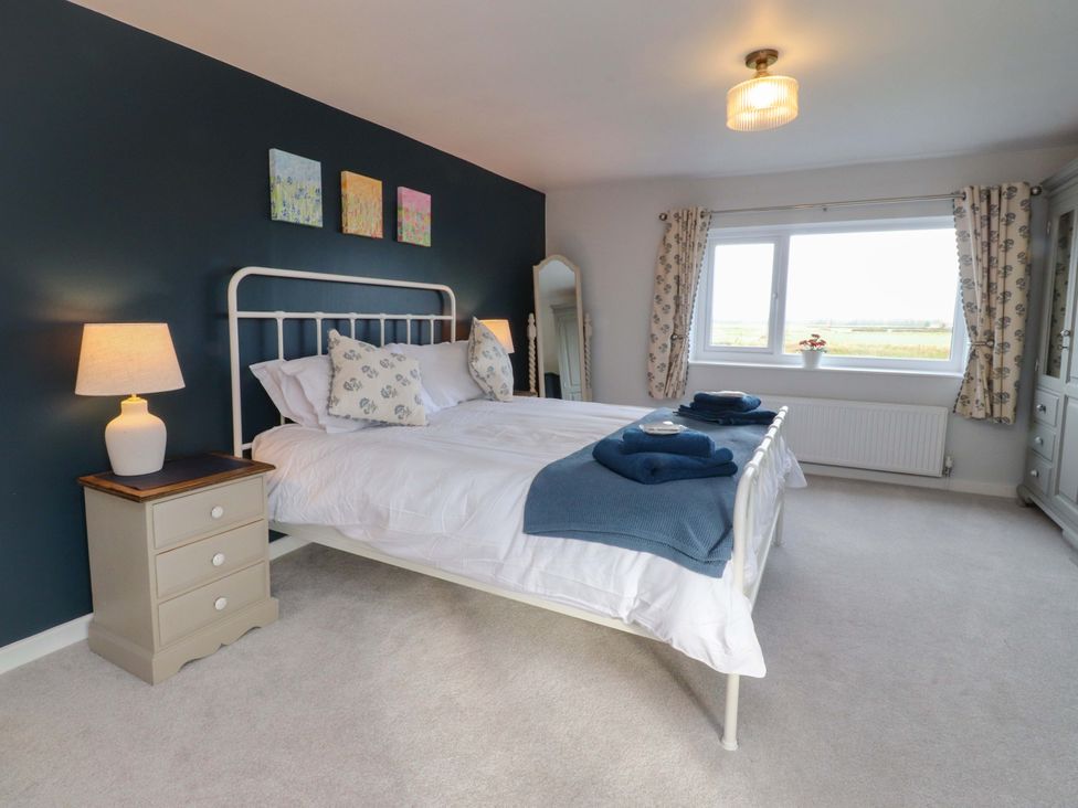 A bedroom with a bed and window at Brook House Broughton, Lancashire