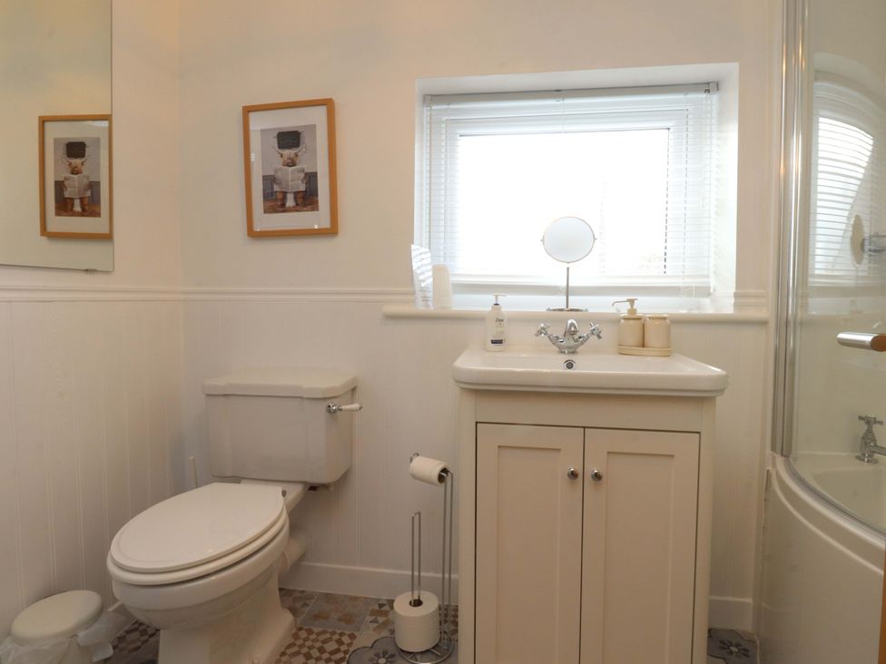 A bathroom with a toilet, sink, and shower at Brook House, Broughton, Lancashire