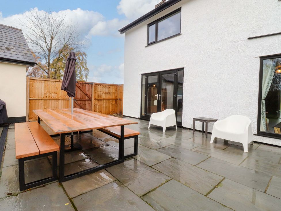An outdoor seating area with a table and chairs at Brook House in Broughton, Lancashire