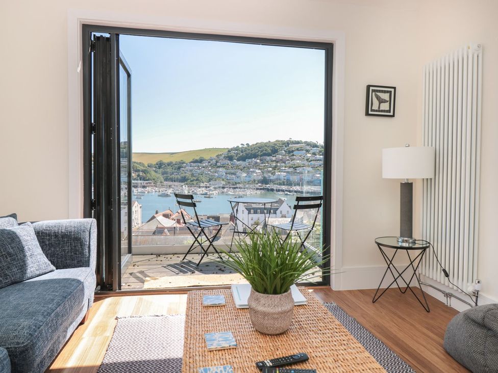 A living room with a view of the harbor at Ty'r Ddraig in Dartmouth