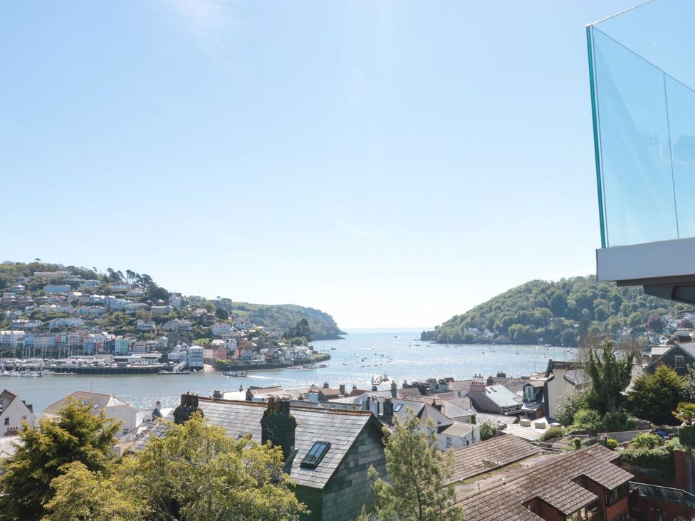 A view of the river and houses at Ty'r Ddraig in Dartmouth