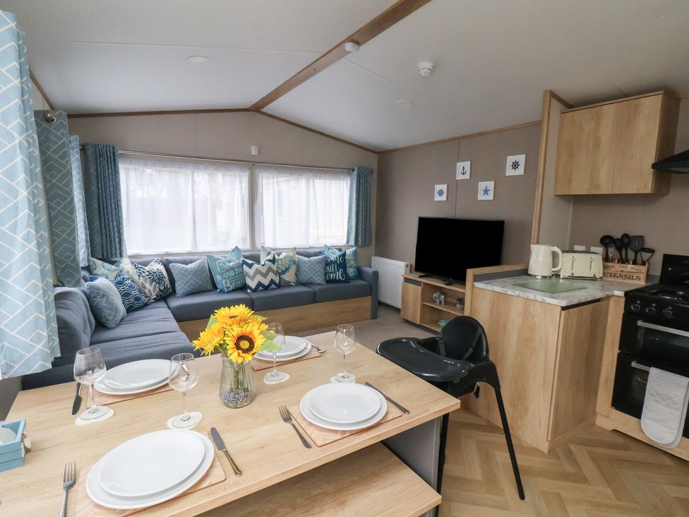 A living room with a sofa and television at No. 7 Ivy in Scarborough