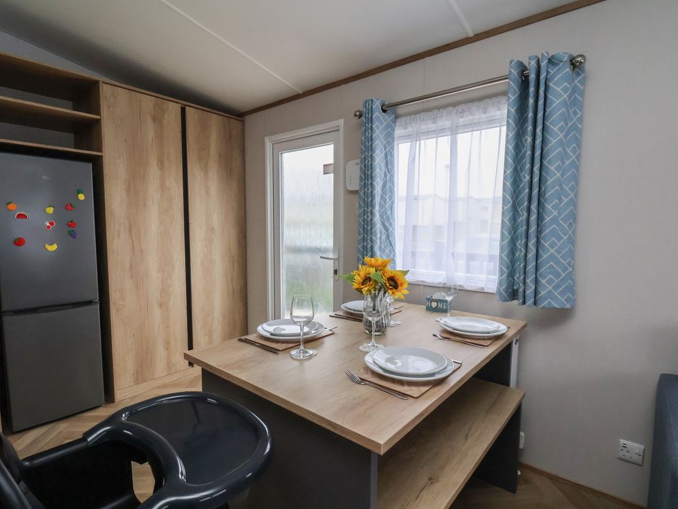 A dining room with a table set for meals at No. 7 Ivy in Scarborough