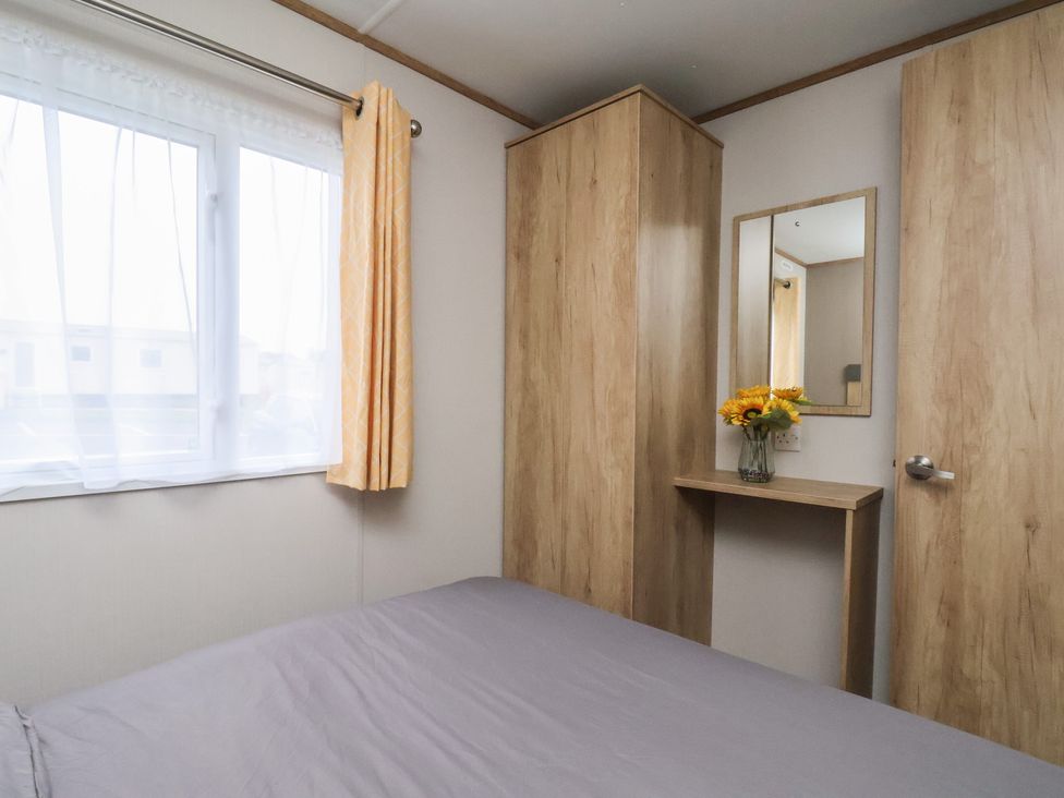 A bedroom with a bed and a window at No. 7 Ivy in Scarborough