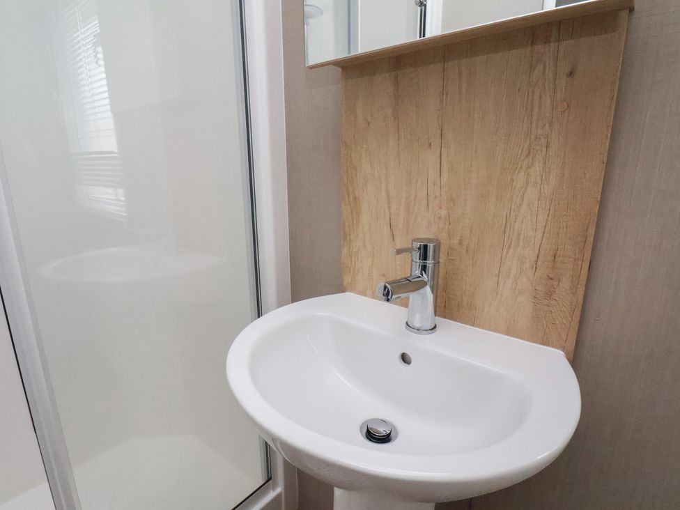 A sink and faucet with a shower in the bathroom at No. 7 Ivy Scarborough