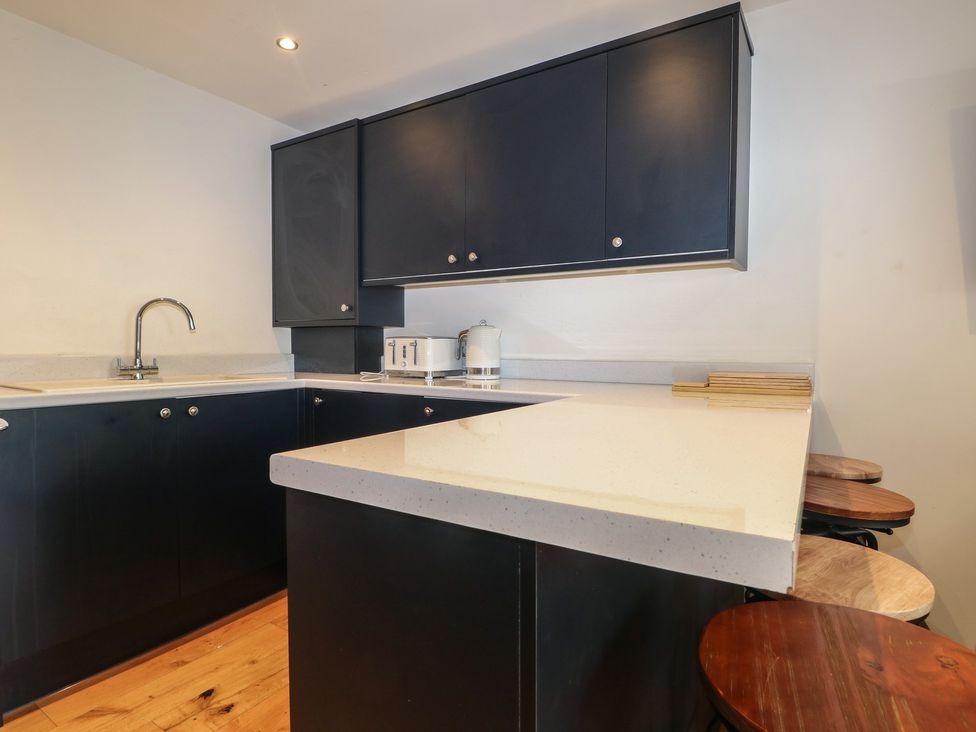 A kitchen with cabinets and countertop at No 1 The Crickets Bognor Regis