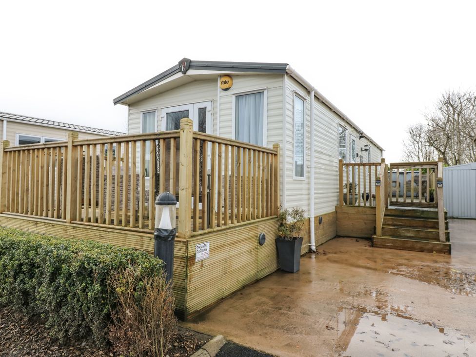 A mobile home with decking and steps at Plot 42 in Carlisle