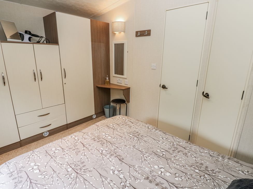 A bedroom with wardrobe and dressing table at Plot 42 Carlisle