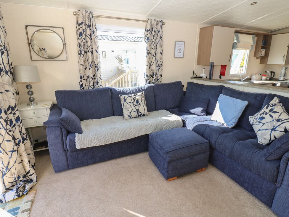 A living room with a sofa and a coffee table at Plot 42 in Armathwaite