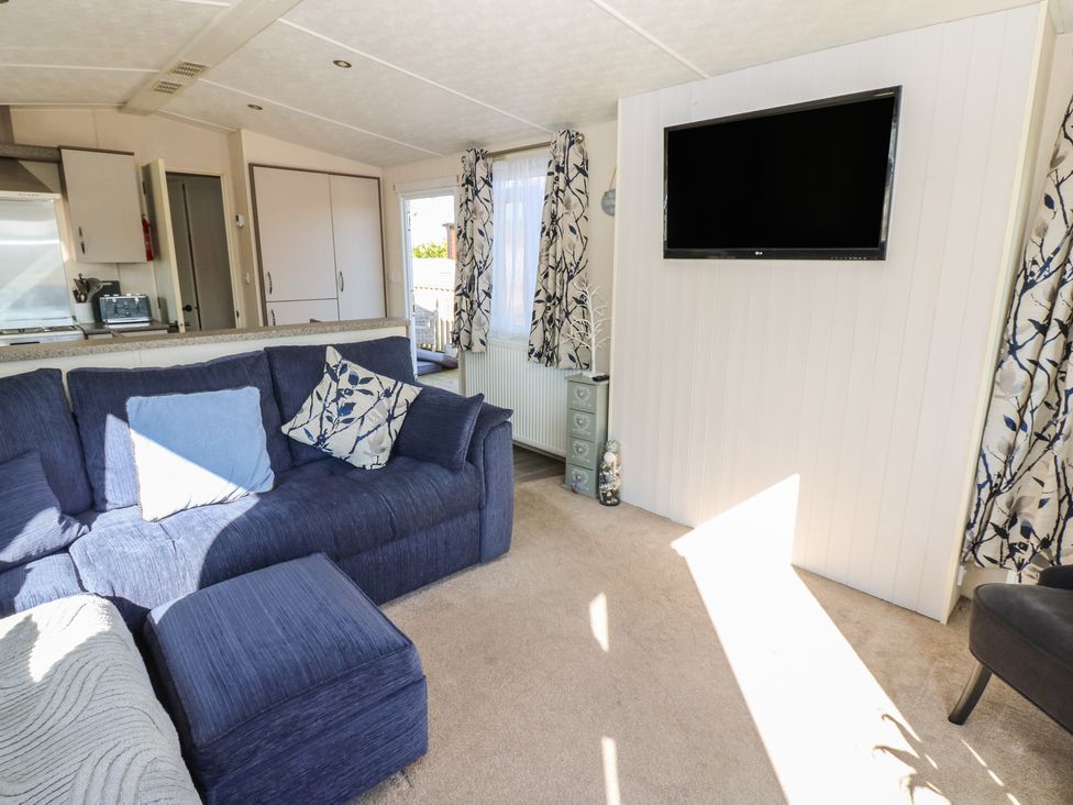 A living room with a sofa and television at Plot 42 in Armathwaite