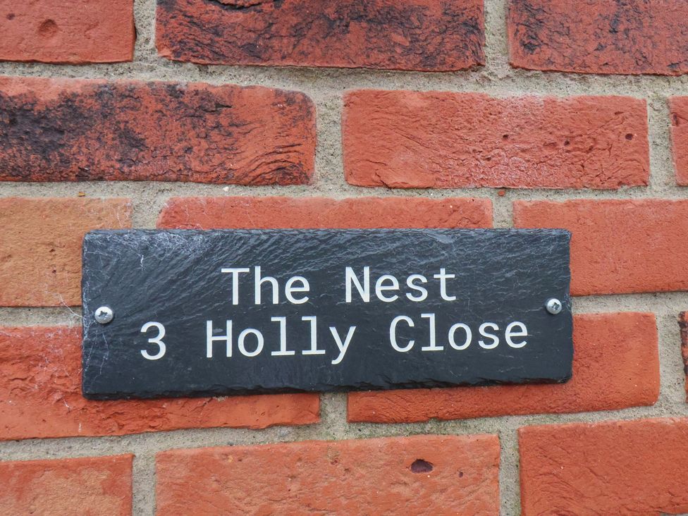 The Nest sign on a wall at The Nest in Buckton near Bridlington