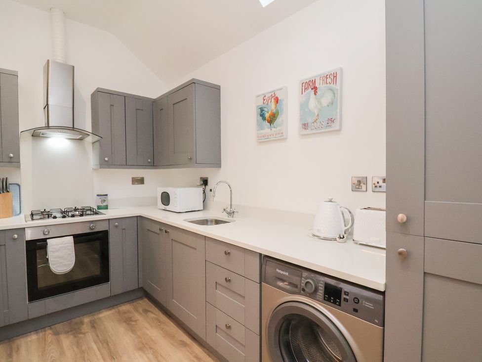 A kitchen with appliances and cabinets at The Nest in Buckton near Bridlington