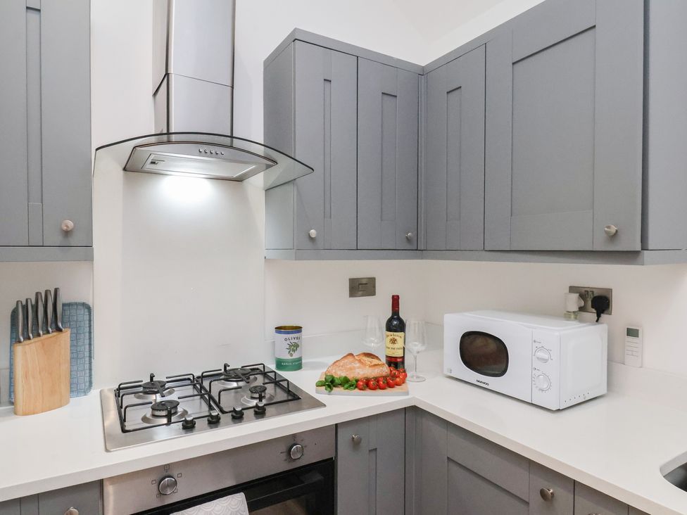 A kitchen with microwave and stove at The Nest in Buckton near Bridlington
