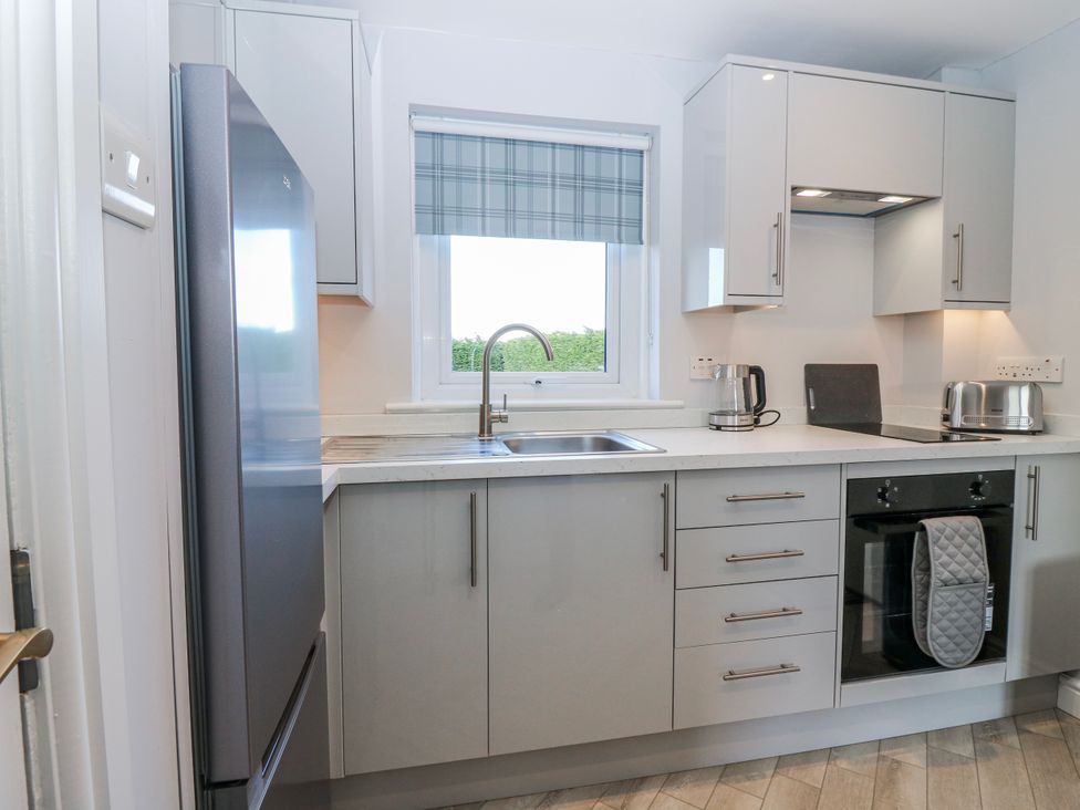 A kitchen with modern appliances and a window at Norwood