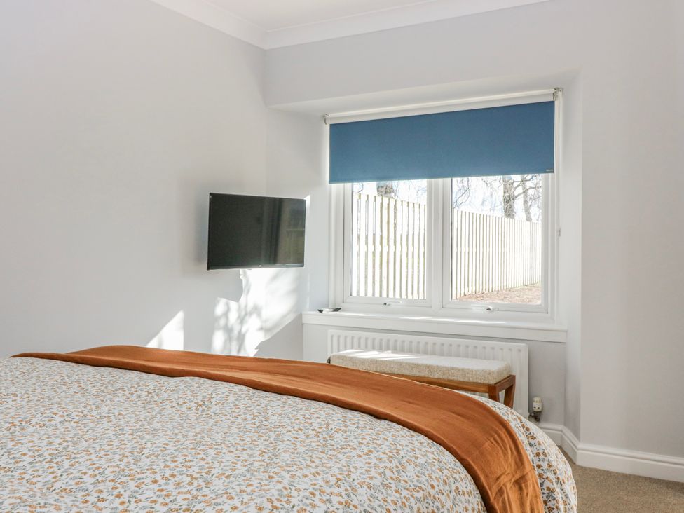 A bedroom with a bed and a television at Norwood 