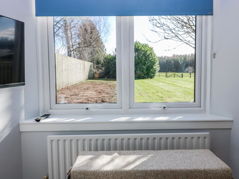 A window with a view to a garden and a radiator at Norwood