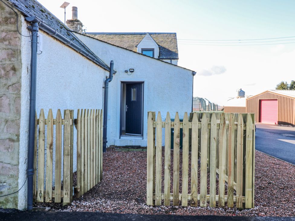 An outdoor area with a fence and door at Norwood