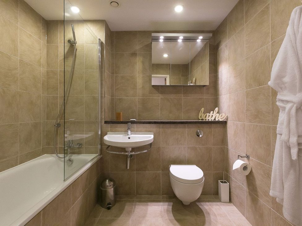 A bathroom with shower, sink and toilet at Mid Air St. Ives