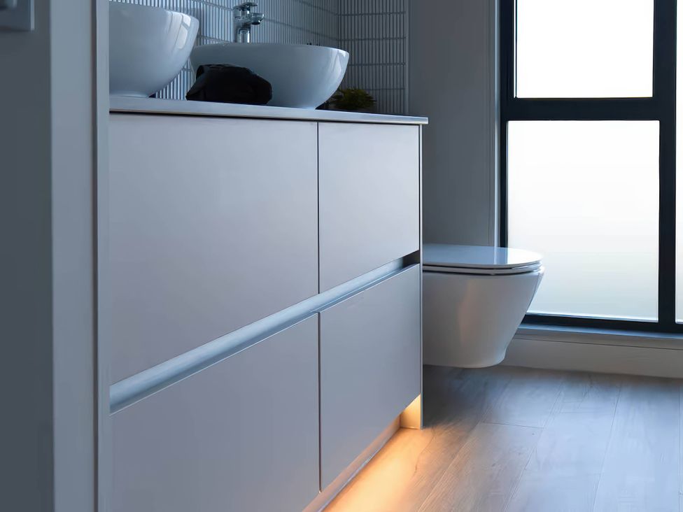 A bathroom with a sink and toilet at Rye Lodge in Wombleton
