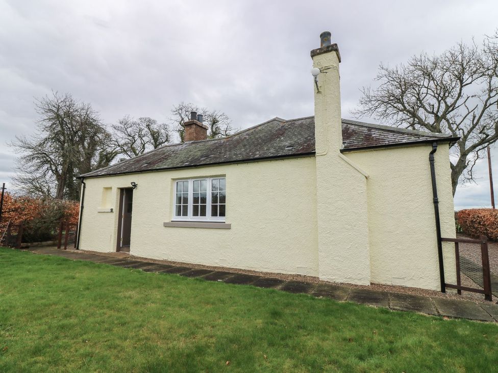 A bungalow with a chimney and pathway at Bankhead Of Lour Bungalow