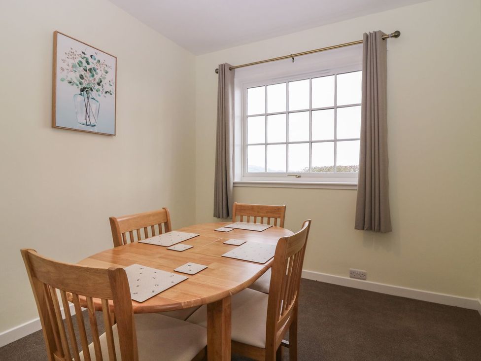 A dining room with a table and chairs at Bankhead Of Lour Bungalow