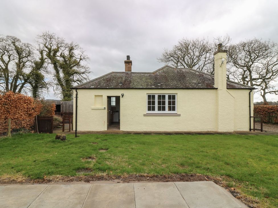 A house with a chimney and garden at Bankhead Of Lour Bungalow