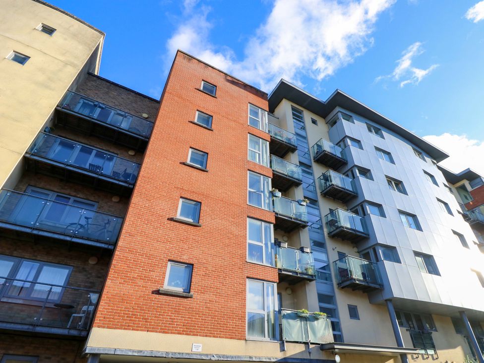 An apartment building with balconies and windows at 53 Orchard Place