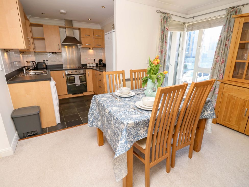 A dining area with table and chairs at 53 Orchard Place